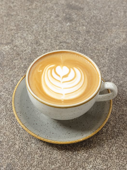 Latte art in speckled cup