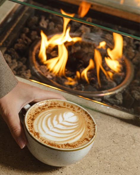 Fireside coffee with soft foam on a cozy evening